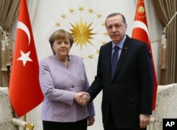 FILE - Turkey's President Recep Tayyip Erdogan, right, meets with German Chancellor Angela Merkel at the Presidential Palace in Ankara, Turkey, Feb. 2, 2017.