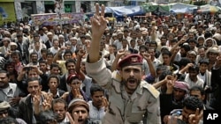 A former army officer, who defected to join anti-government protesters, shouts slogans during a rally demanding the ouster of Yemen's President Ali Abdullah Saleh in Sana'a October 4, 2011.
