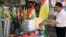 FILE - A Kurdish man sells flags of the semi-autonomous region of Kurdistan in his shop in Arbil, 310 km (193 miles) north of Baghdad, Aug. 30, 2009.