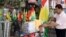FILE - A Kurdish man sells flags of the semi-autonomous region of Kurdistan in his shop in Arbil, 310 km (193 miles) north of Baghdad, August 30, 2009.