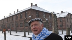 FILE - Former prisoner Stanislaw Zalewski attends the 74th anniversary of the liberation of former German Nazi death camp Auschwitz-Birkenau, in Oswiecim, Poland, on Jan. 27, 2019. He'll return for the 75th anniversary on Monday.