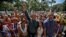 FILE - Lawmaker Romel Guzamana, center, protests with supporters in Caracas, Venezuela, Jan. 13, 2016. Dozens of Indians under the cry of "justice, justice," protested the removal of three Amazonas state elected congress members from the National Assembly. Guzamana is one of three lawmakers who were barred by the Supreme Court from taking office due to irregularities during the election.