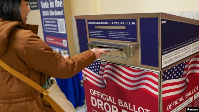A voter casts their ballot during early voting, a day ahead of the Super Tuesday primary election, at the San Francisco City Hall voting center in San Francisco, California, March 4, 2024.