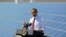 FILE - President Barack Obama speaks after touring solar panel facility, Boulder City, Nevada, March 21, 2012.