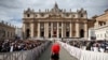 FILE - A Swiss Guard stands on the day Pope Francis attends a mass to canonize fourteen new saints in St. Peter's Square at the Vatican, Oct. 20, 2024. 