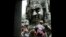 A tourist poses for photographs in the Bayon Temple in the northern province of Siem Reap, about 320 km (199 miles) from Phnom Penh August 31, 2010. Tourist arrivals to Cambodia increased by 14 percent to 1.42 million people, during the first seven months this year as compared to the same period in 2009, said Kong Sophearak, Director of Statistics at the Tourism Ministry. REUTERS/Chor Sokunthea 