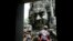 A tourist poses for photographs in the Bayon Temple in the northern province of Siem Reap, file photo. 