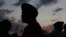 Flags fly at half staff as Sikhs prepare for a vigil in Oak Creek, Wisconsin, August 7, 2012. 