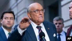 Rudy Giuliani speaks after leaving federal court in Washington, Jan. 10, 2025. A judge found Giuliani in contempt of court for violating orders barring him from continuing to defame two Georgia election workers.