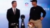 San Francisco 49ers head coach Jim Harbaugh (R) and his brother, Baltimore Ravens head coach John Harbaugh, appear at their joint press conference and stand next to the Vince Lombardi trophy ahead of the NFL's Super Bowl XLVII in New Orleans, Louisiana, F