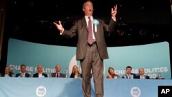 FILE - British politician Nigel Farage speaks during a Brexit Party rally at Lakeside Country Club in Frimley Green in Surrey, England, May 19, 2019. 