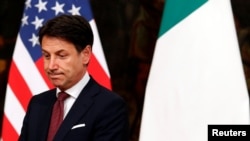 FILE - Italian Prime Minister Giuseppe Conte waits for U.S. Secretary of State Mike Pompeo in Rome, Italy, Oct. 1, 2019.