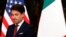 FILE - Italian Prime Minister Giuseppe Conte waits for U.S. Secretary of State Mike Pompeo in Rome, Italy, Oct. 1, 2019.