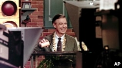 This June 28, 1989 file photo shows Fred Rogers taping a segment of his television program Mister Rogers' Neighborhood in Pittsburgh.