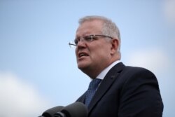 FILE - Australian Prime Minister Scott Morrison speaks during a joint press conference held with New Zealand Prime Minister Jacinda Ardern at Admiralty House in Sydney, Australia, Feb. 28, 2020.