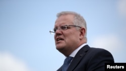 FILE - Australian Prime Minister Scott Morrison speaks during a joint press conference held with New Zealand Prime Minister Jacinda Ardern at Admiralty House in Sydney, Australia, Feb. 28, 2020. 