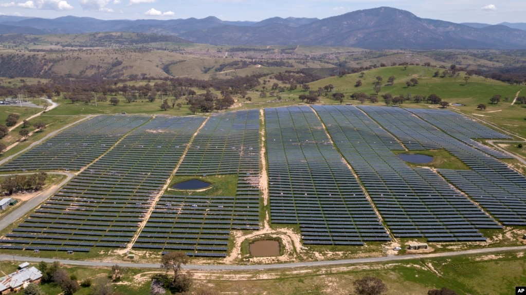 FILE - The Williamsdale Solar Farm, shown from the air and located south of Canberra, Australia, on Oct. 15, 2020, has about 30 hectares (74 acres) of solar panels. (Mick Tsikas/AAP Image via AP)