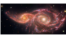 Gambar oleh Teleskop Antariksa NASA memperlihatkan IC 2163, galaksi spiral kecil di sebelah kiri yang melintas di belakang NGC 2207, galaksi spiral yang lebih besar di sebelah kanan. Galaksi-galaksi tersebut saling bergesekan jutaan tahun yang lalu. Kedua galaksi tersebut memiliki tingkat pembentukan bintang yang tinggi. Setiap tahun, galaksi-galaksi tersebut menghasilkan 24 bintang baru yang ukurannya sama dengan Matahari. (courtesy: NASA)