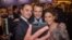 Emmanuel Macron, center, candidate for the 2017 French presidential election, poses for a selfie with guests during the annual dinner of the Representative Council of France's Jewish Associations in Paris, Feb. 22, 2017. 