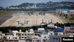 FILE - U.S. Marine Corps MV-22 Osprey aircrafts are seen at the U.S. Marine Corps' Futenma Air Station in Ginowan on Japan's southernmost island of Okinawa, March 24, 2018.