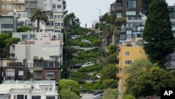 Cars wind their way down Lombard Street in San Francisco, April 15, 2019. Thousands of tourists may soon have to pay as much as $10 to drive down the world-famous crooked street if a proposal to establish a toll and reservation system becomes law. 