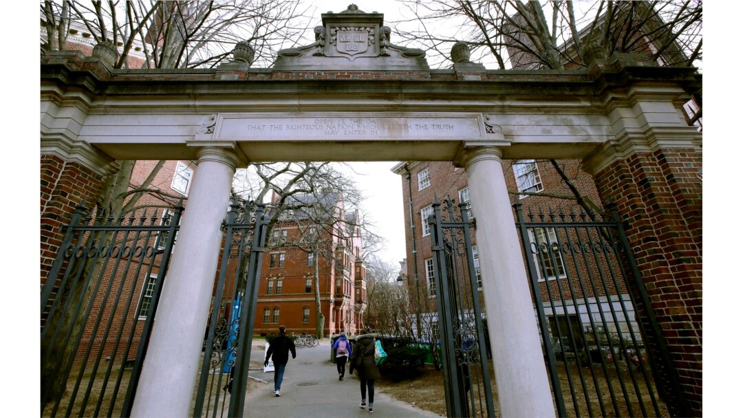 FILE - A gate opens to the Harvard University campus in Cambridge, Mass., Dec. 13, 2018.