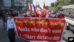 Buddhist monks march during a protest against the military coup in Yangon, Myanmar Tuesday, Feb. 16, 2021. (AP photo)