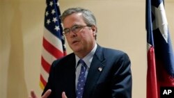 Former Florida Governor Jeb Bush talks with the media following his address on education to the Texas Business Leadership Council in Austin, Texas. 