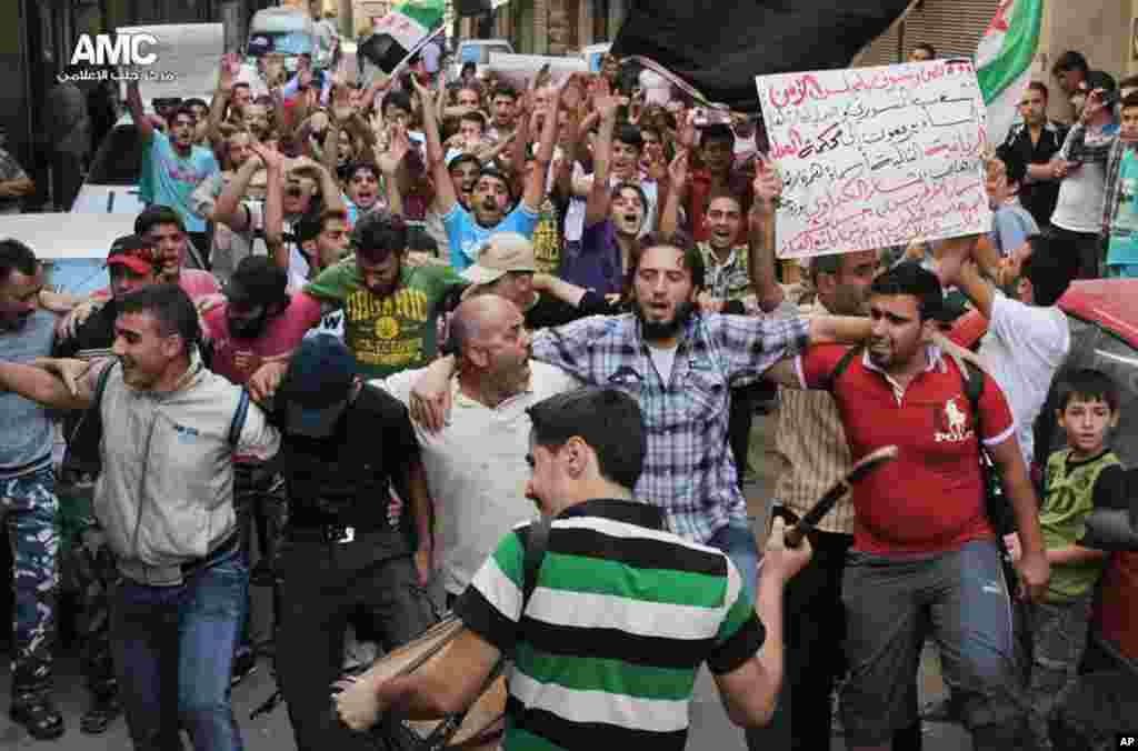 This citizen journalism image provided by Aleppo Media Center AMC, shows anti-Syrian regime protesters chanting slogans during a demonstration in Aleppo, Sept. 6, 2013.&nbsp;