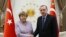 FILE - Turkey's President Recep Tayyip Erdogan meets with German Chancellor Angela Merkel at the Presidential Palace in Ankara, Feb. 2, 2017. The two will next meet Jan. 24, 2020, in Istanbul.