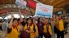 Tourists pose for a photograph at the departure hall of the China-Zhuhai-Macau-Hong Kong Bridge during the first day operation of the world's longest cross-sea project, which has a total length of 55 kilometers (34 miles), in Hong Kong, Oct. 24, 2018. 