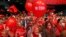 Supporters of the Social Democratic Party (SDP) wave flags and balloons during a final pre-election rally in Sarajevo, Bosnia, Oct. 9, 2014. 