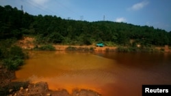 A contaminated lake is seen near Dabaoshan in the northern part of China's Guangdong province August 27, 2009.