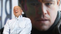 Microsoft Chief Executive Steve Ballmer in front of an image of actor Matt Damon at the Consumer Electronics Show in Las Vegas