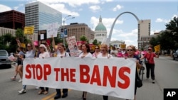 FILE - Abortion-rights supporters march in St. Louis, May 30, 2019.