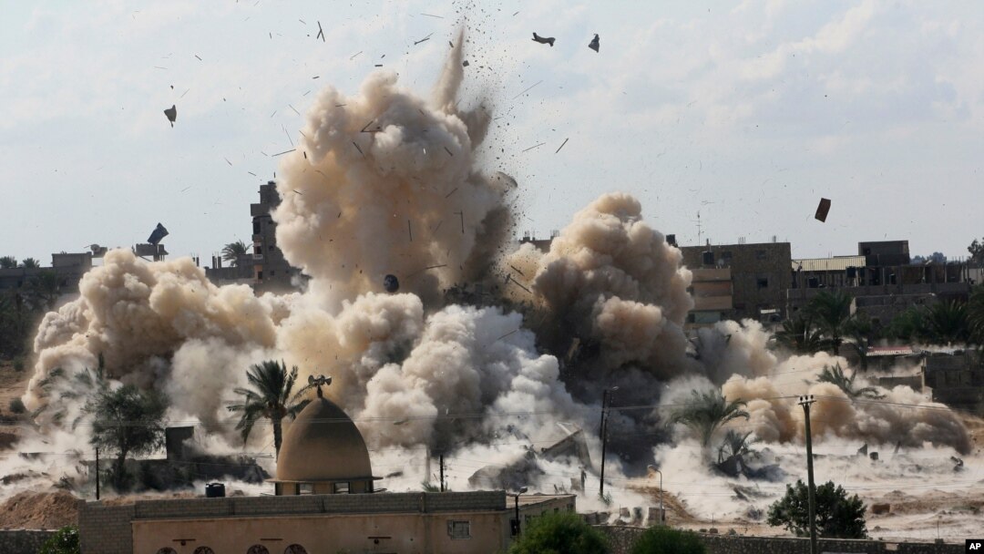  In this Oct. 29, 2014, file, photo, smoke rises after Egyptian army demolished houses on the Egyptian side on border town of Rafah.