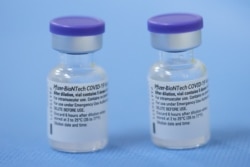 Switzerland, Geneva, Vials of the Pfizer-BioNTech vaccine are pictured in a vaccination centreVials of the Pfizer-BioNTech vaccine are pictured in a vaccination centre