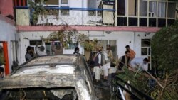 FILE - In this Aug. 29, 2021 file photo, Afghans inspect damage of Ahmadi family house after U.S. drone strike in Kabul, Afghanistan.