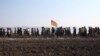 African migrant laborers stage a march to protest against their work conditions in Italy, following the death of 16 of their colleagues in two separate road accidents, near Foggia, Italy, Aug. 8, 2018. 