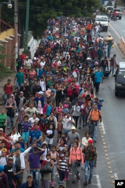 Honduran migrants walking to the U.S. start their day departing Chiquimula, Guatemala, Oct. 17, 2018.