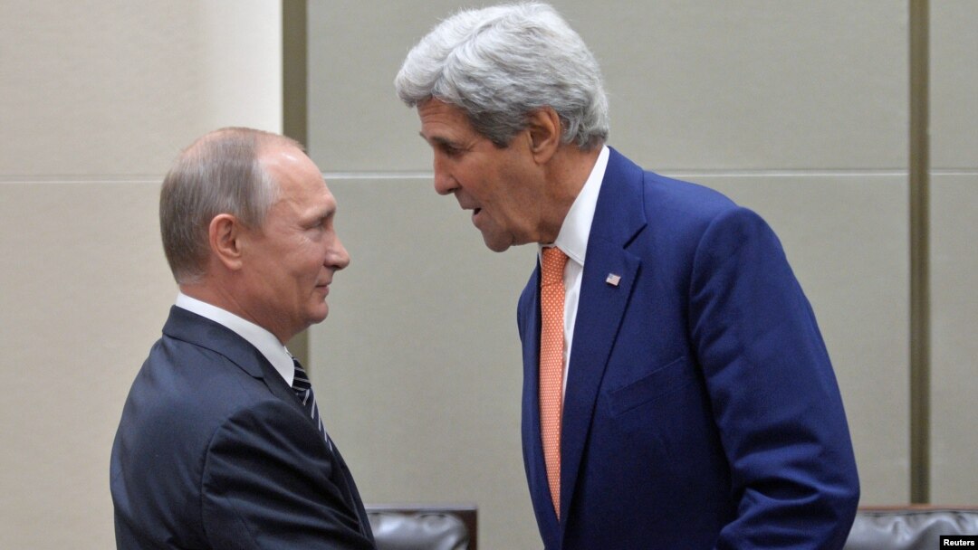 Russian President Vladimir Putin (L) greets U.S. Secretary of State John Kerry ahead of a meeting with U.S. President Barack Obama (not seen) on the sidelines of the G-20 Summit in Hangzhou, China, Sept. 5, 2016.