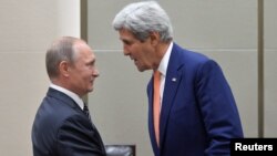 Russian President Vladimir Putin (L) greets U.S. Secretary of State John Kerry ahead of a meeting with U.S. President Barack Obama (not seen) on the sidelines of the G-20 Summit in Hangzhou, China, Sept. 5, 2016.