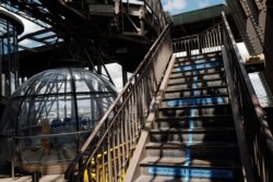 Visitor stairs are demarcated with social distancing stickers during a presentation of the security measures at the Eiffel Tower in Paris, June 16, 2020. The Eiffel Tower will partially reopen on June 25.