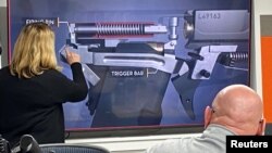 Ginger Chandler, LodeStar Works SVP and Chief Technical Officer, makes presentation on their smart gun to investors in Boise, Idaho, U.S. January 7, 2022. ( REUTERS/Brian Losness)