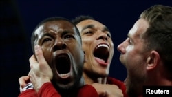 Liverpool's Georginio Wijnaldum celebrates scoring their third goal with Jordan Henderson and Trent Alexander-Arnold REUTERS/Phil Noble - RC1F8730263