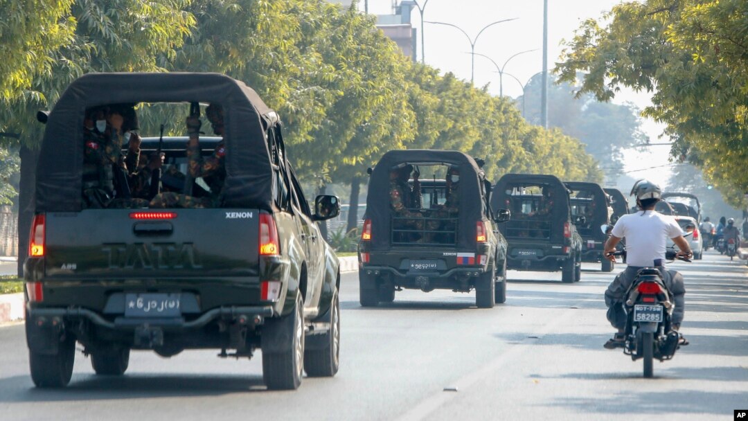 FILE - A convoy of army vehicles patrol the streets in Mandalay, Myanmar, Wednesday, Feb. 3, 2021.