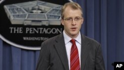 Pentagon Press Secretary George Little gestures during a news conference, December 22, 2011. 