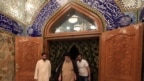 Iraqi Shi'ite cleric Moqtada al-Sadr visits his father's grave after parliamentary election results were announced, in Najaf, Iraq, May 14, 2018. 