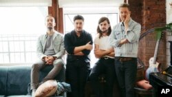 FILE - Members of Mumford & Sons, from left, Ben Lovett, Marcus Mumford, Winston Marshall and Ted Dwane pose for a portrait in New York to promote their fourth album "Delta," Sept. 28, 2018.