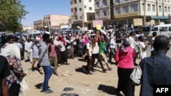 Sudanese demonstrators gather in Khartoum's twin city Omdurman, Jan. 20, 2019, where Sudanese police fired tear gas at protesters ahead of a planned march on parliament.